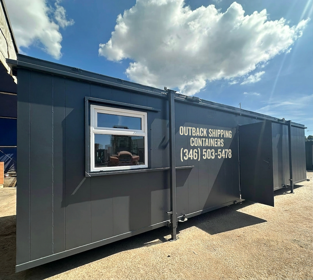 Refurbished 32ft dark gray canteen office cabin and toilet block structure with a white window and open metal door