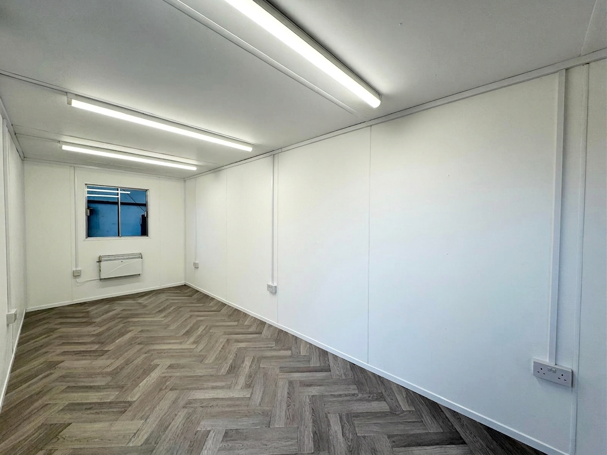 Refurbished 20x8 gray metal portable office container with single steel door and external electrical connection