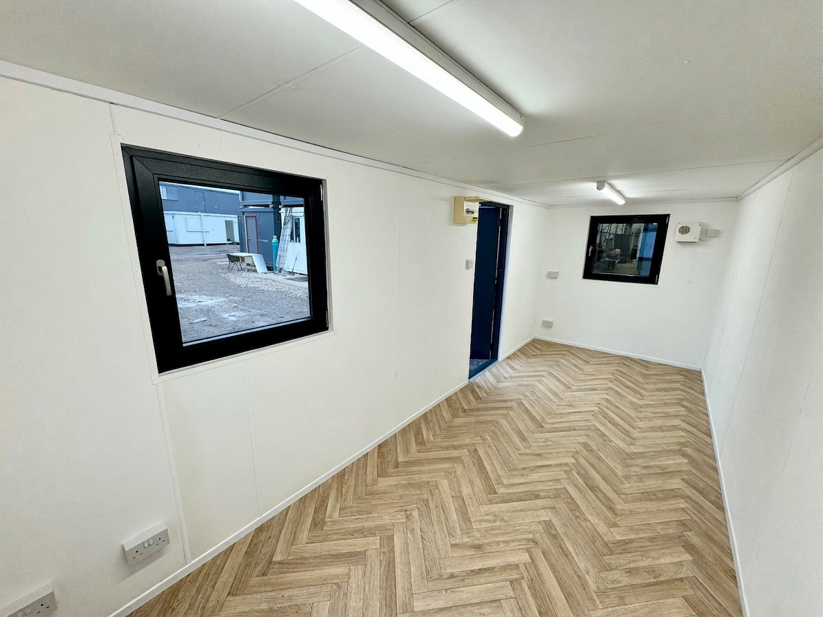 21x8ft refurbished office container interior with herringbone vinyl flooring and white walls